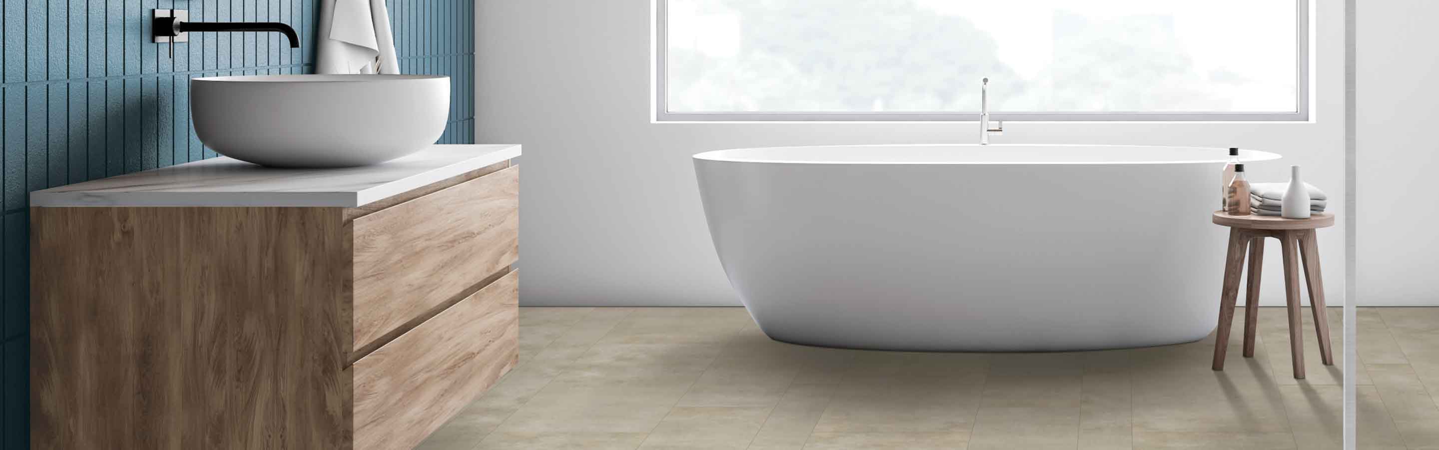 Bathroom with deep soak tub and wood vanity, stone look vinyl flooring and blue accent wall